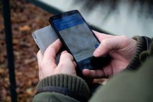 https://www.pexels.com/photo/person-using-google-maps-application-through-black-android-smartphone-35969/