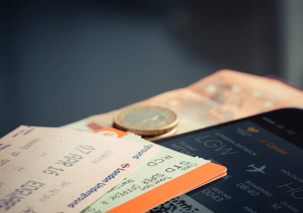 https://www.pexels.com/photo/orange-and-green-label-airplane-ticket-69866/